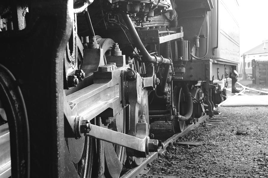Passing Steam Locomotive In Black And White Photograph