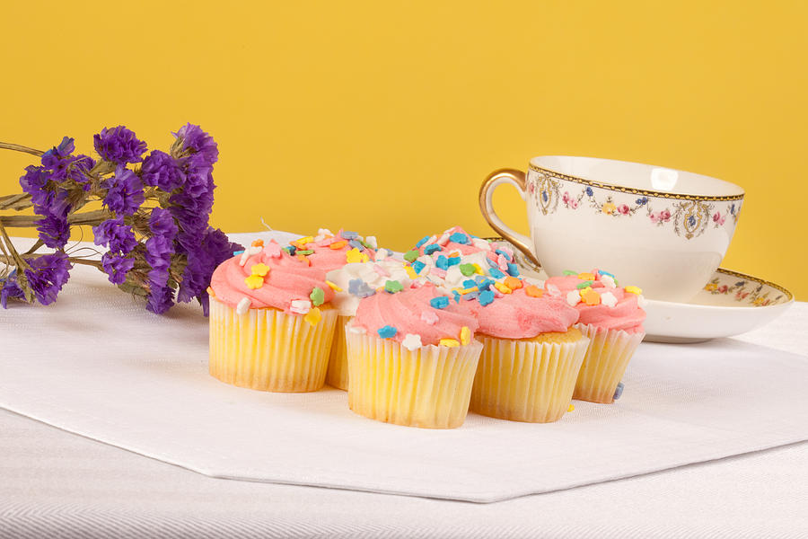 Pastel colored cupcakes Photograph by Kyle Lee