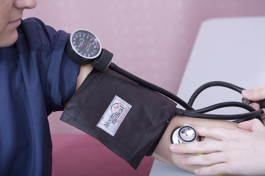 Patient Having Blood Pressure Taken Photograph by Science Stock Photography