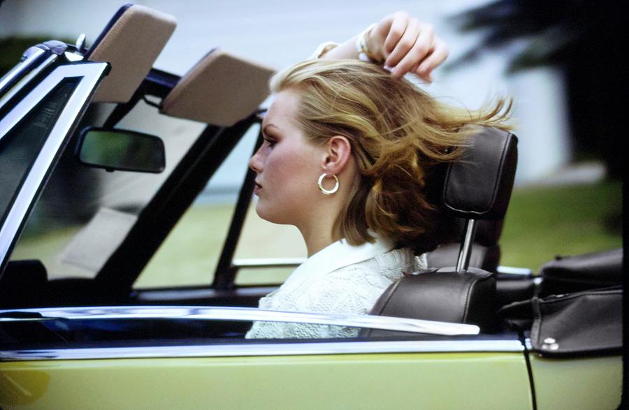 Patti Hansen Driving A Car Photograph by Arthur Elgort