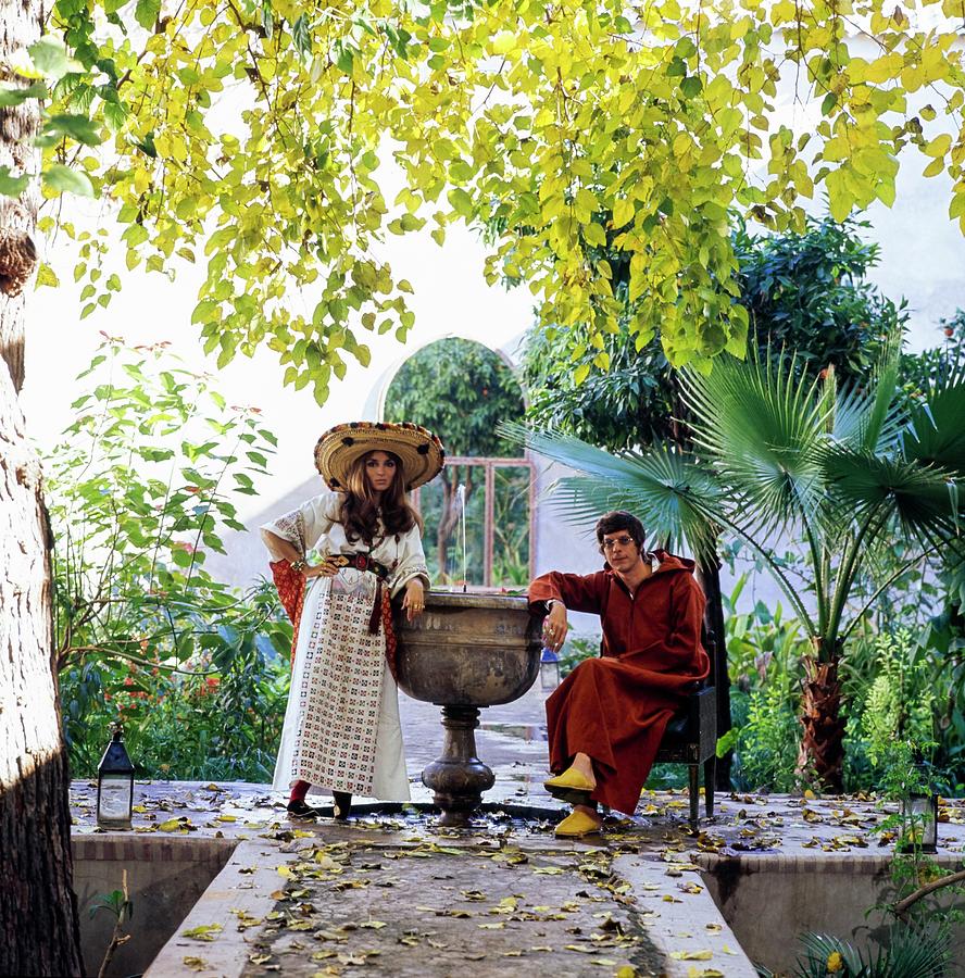Paul And Talitha Getty By Fountain Photograph by Patrick Lichfield
