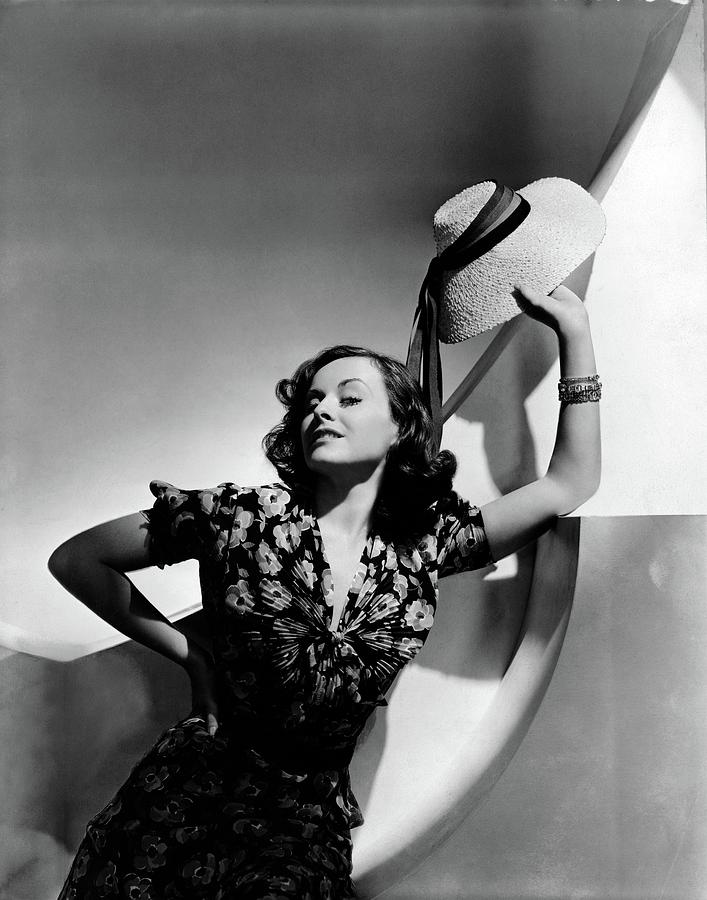 Paulette Goddard Holding A Straw Hat Photograph by Horst P. Horst