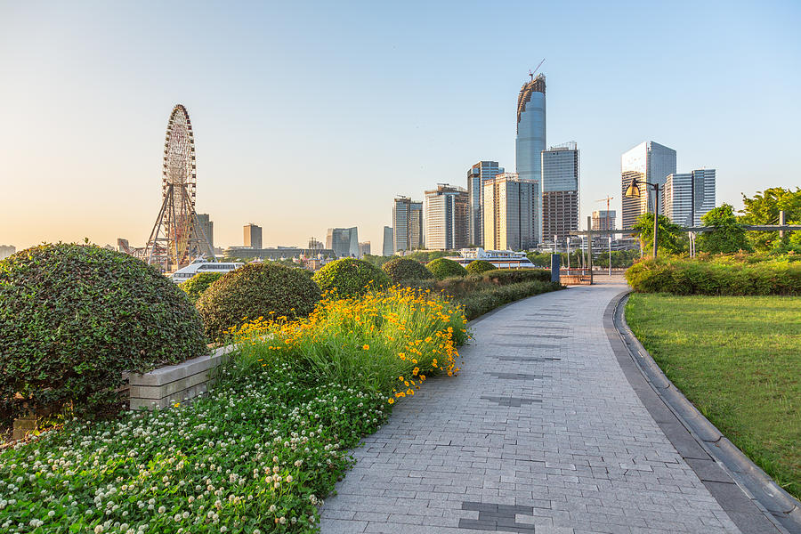 Pavement  In An Urban Park With Business District In Background Photograph by Fanjianhua