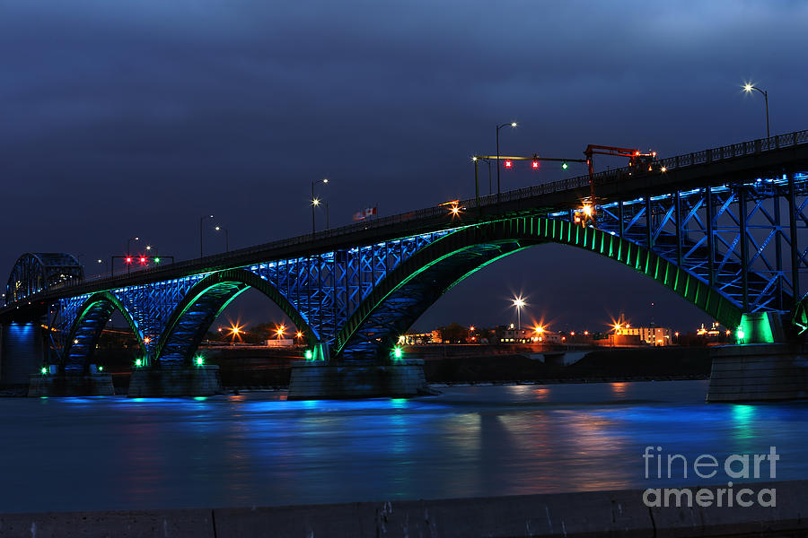 Peace Bridge with green and blue lights Photograph by Kim French