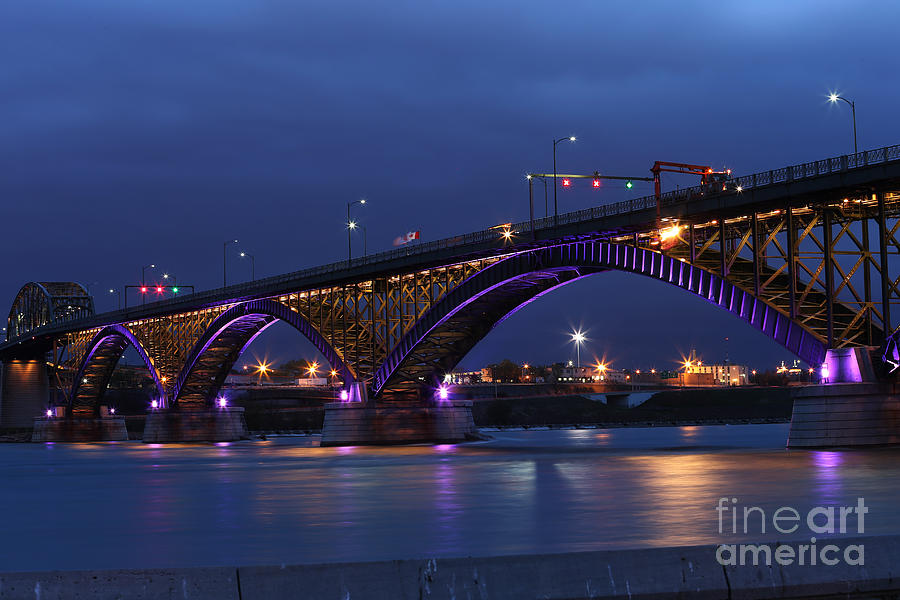 Peace Bridge with purple and gold lights Photograph by Kim French