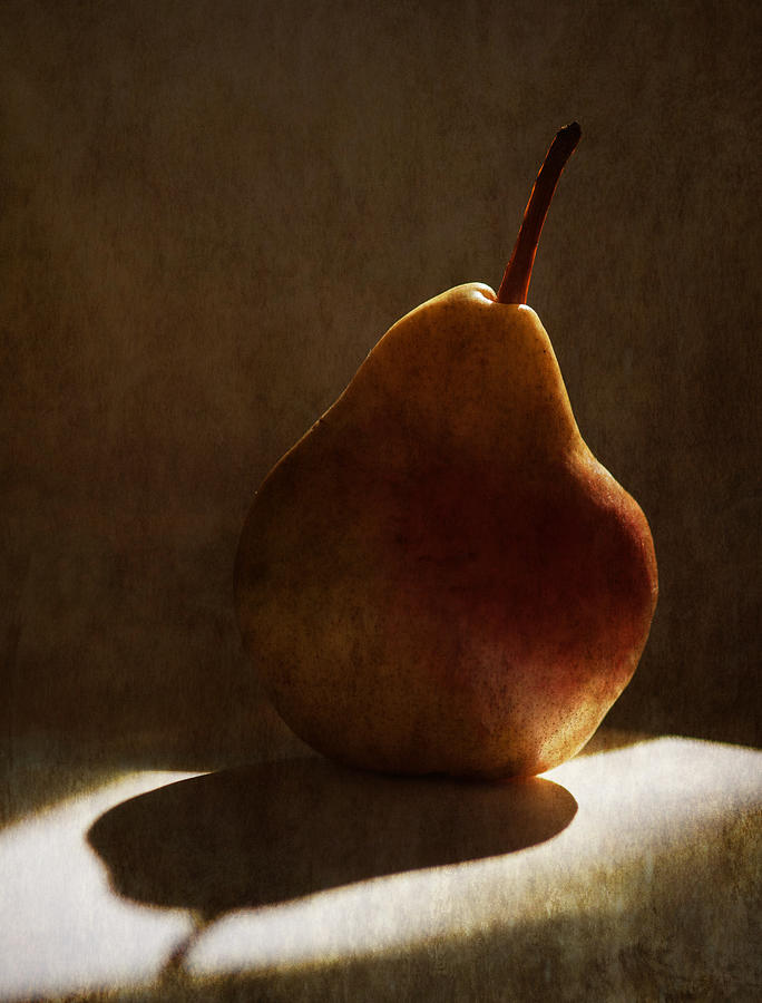 Pear light Photograph by Carolyn DAlessandro