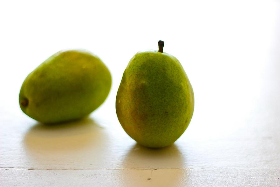 Pear Photograph - Pears on a White Background by Kathleen Odenthal