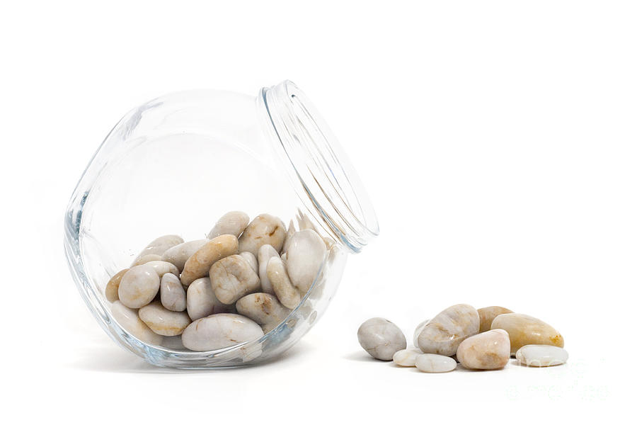 Pebbles Photograph - Pebbles and Glass Jar against White Background by Natalie Kinnear