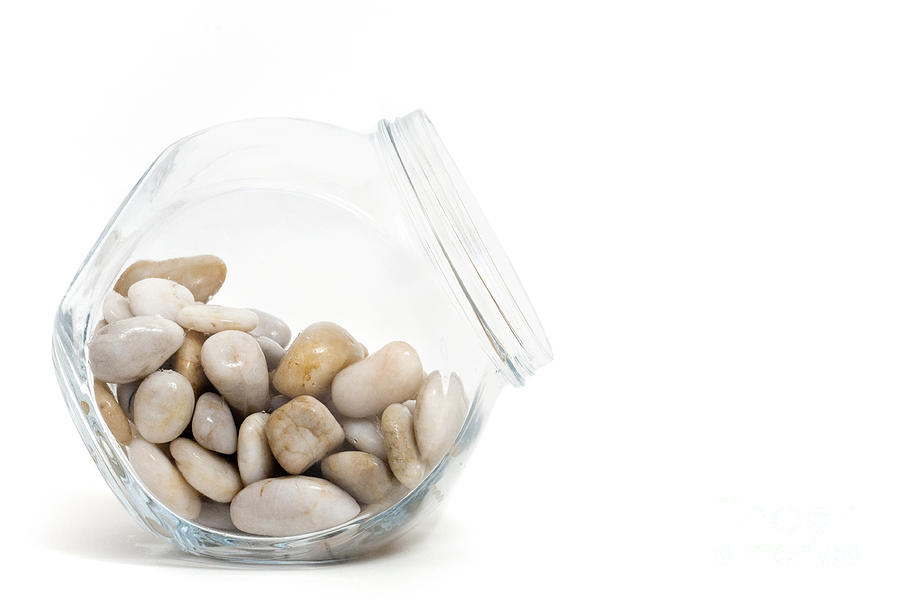 Pebbles Photograph - Pebbles in a Glass Jar against White Background by Natalie Kinnear