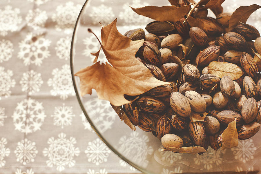 Pecan Nuts In Glass Bowl Photograph by Julia Goss