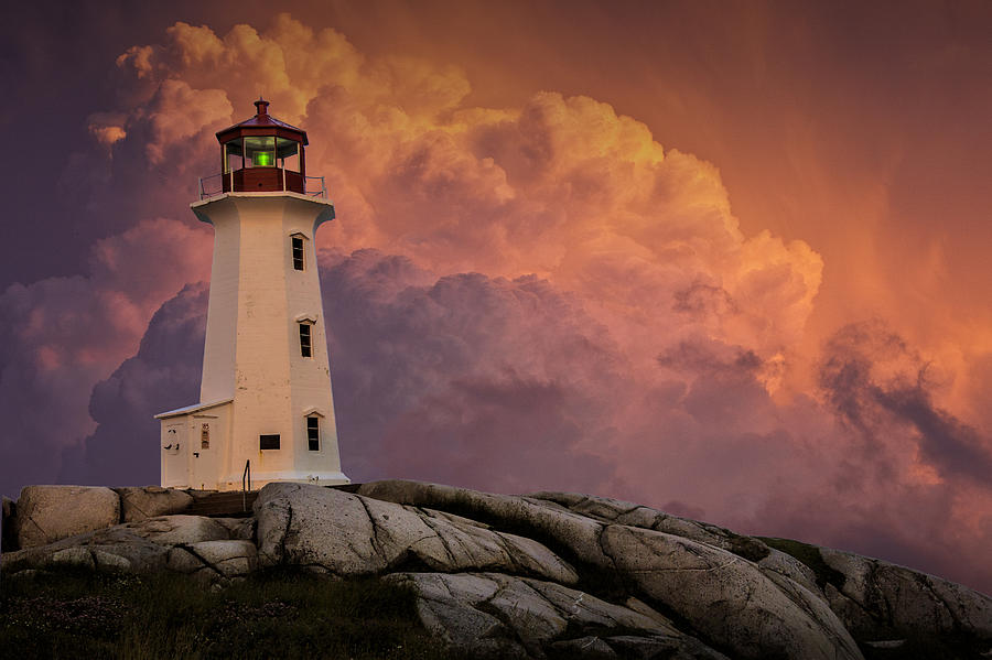 Peggys Cove Lighthouse in Nova Scotia with Red Stormy Sky Photograph by Randall Nyhof