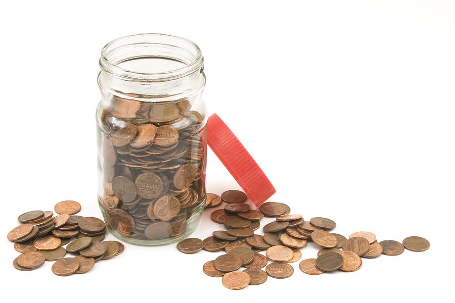 Pennies And Jar On White Background Photograph by Keith Webber Jr