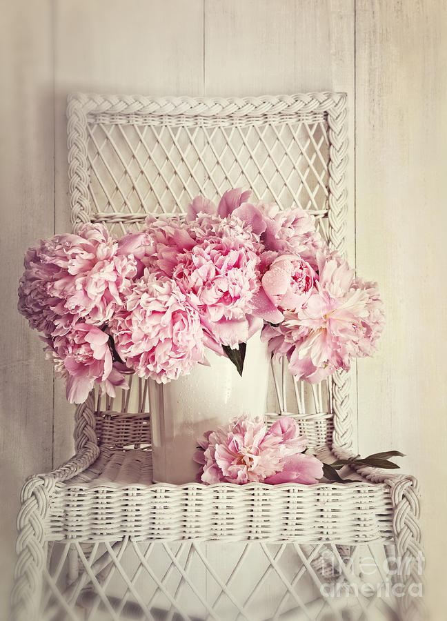 Peonies in vase on old wicker chair Photograph by Sandra Cunningham