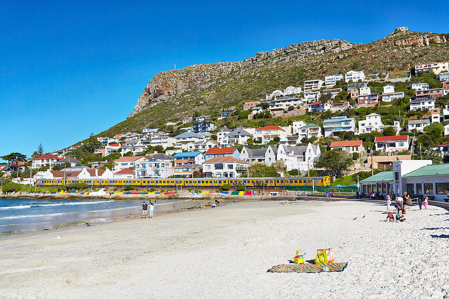 People enjoying the beachside Town of Fish Hoek Photograph by Peter Unger