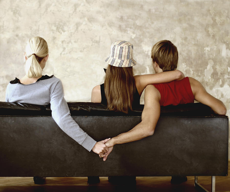People Holding Hands on Sofa Photograph by Hannes Hepp People Holding Hands on Sofa Photograph by Hannes Hepp