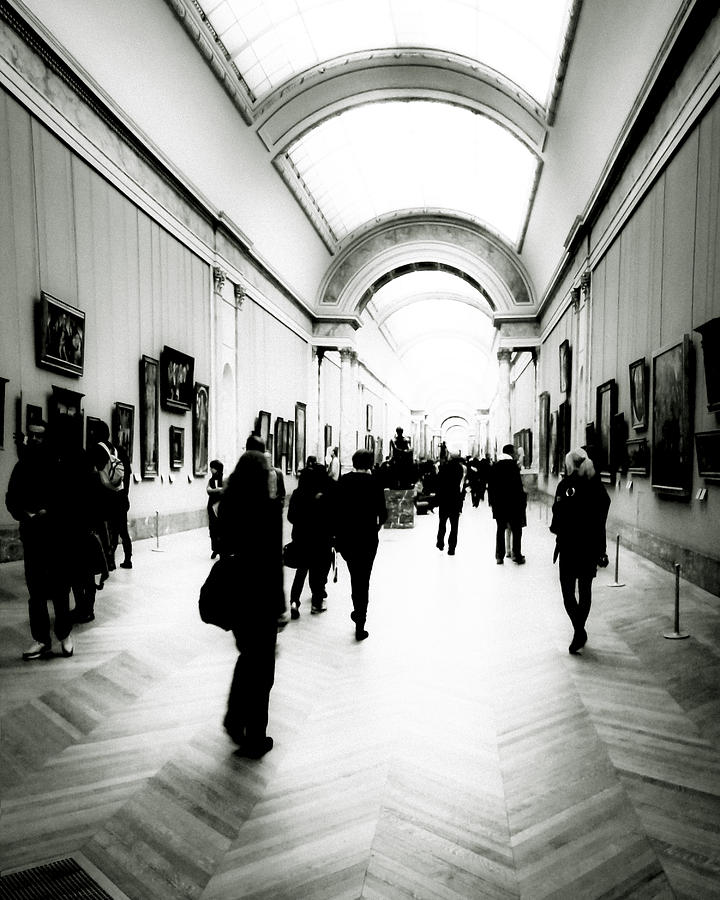 People in Motion in the Louvre Photograph by Mark Tisdale