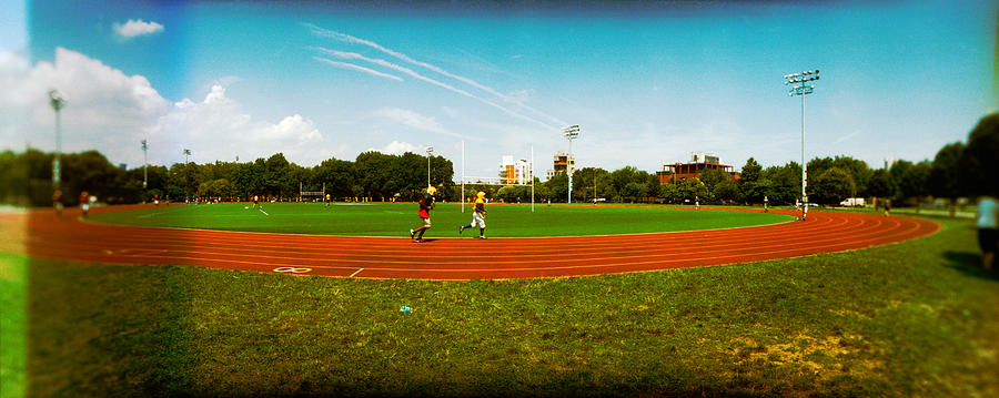 People Jogging In A Public Park Photograph by Panoramic Images