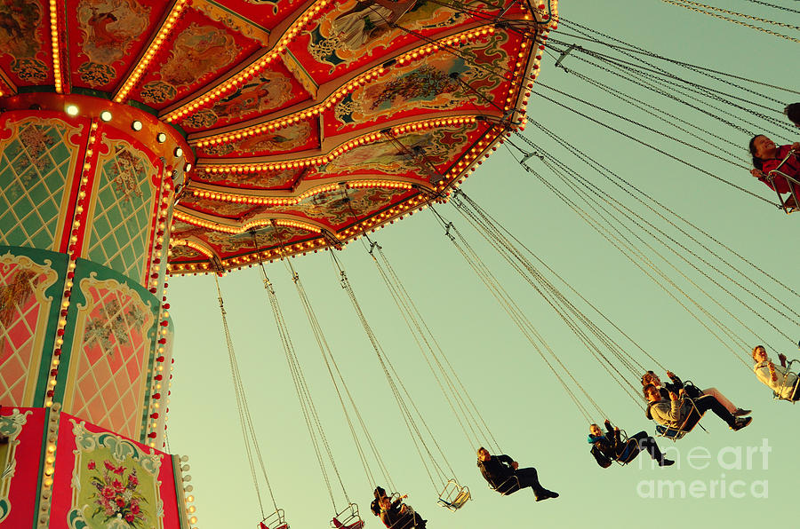 People on a Vintage Carousel at the Octoberfest in Munich Photograph by Sabine Jacobs