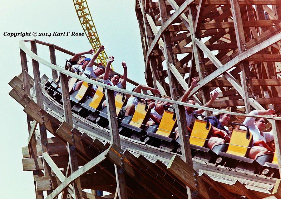 People on roller coaster Photograph by Karl Rose