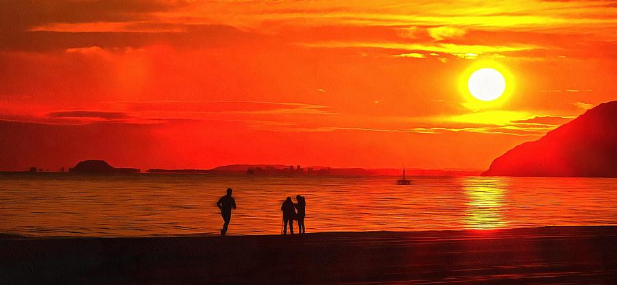 People on the shore at sunset in Spain Photograph by Mick Flynn