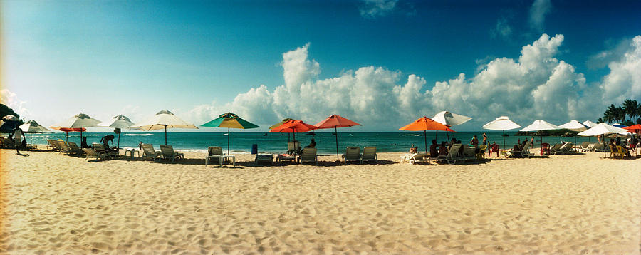 Nature Photograph - People Relaxing Under Umbrellas by Panoramic Images