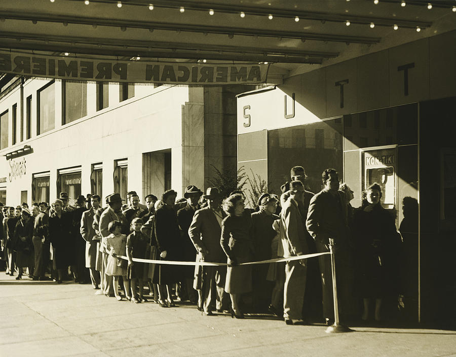 People standing in line at cinema in Manhattan, New York City, (B&W) Photograph by George Marks