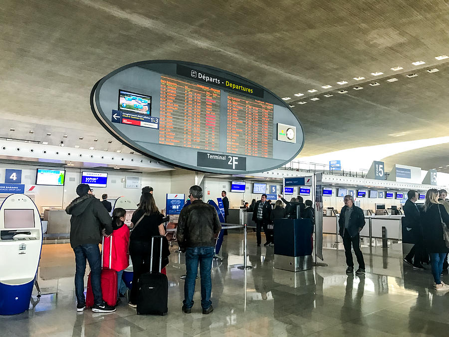 People traveling through Roissy Charles de Gaulle Airport, Paris, France Photograph by Anouchka