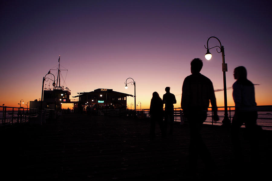 People Walking At Sun Set At The Santa Photograph by Todd Korol - Fine ...