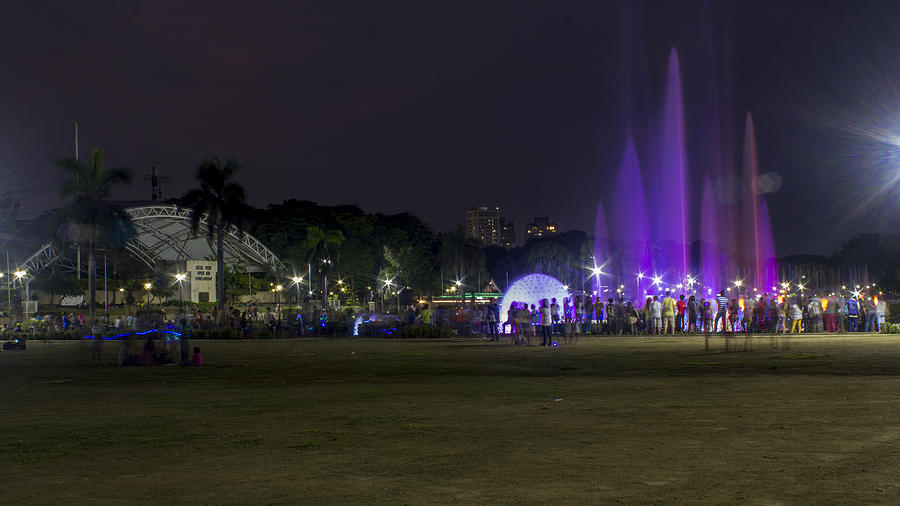 People watching Musical Dancing Fountain at Rizal Park Photograph by Chris Dela Cruz