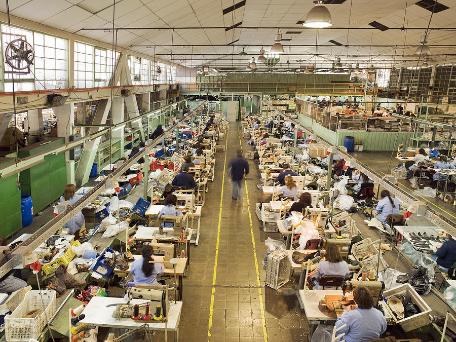 People working in a shoe factory Photograph by Felipe Dupouy