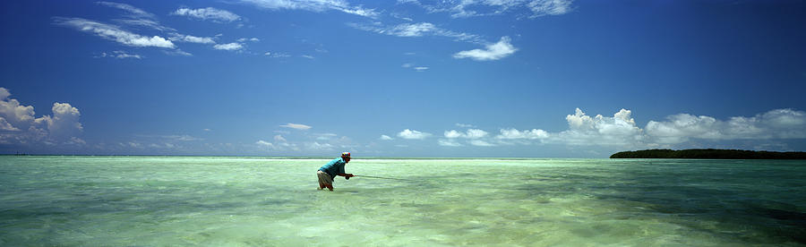 Person Fishing On The Beach Photograph by Panoramic Images