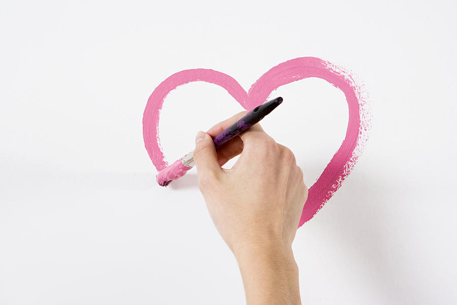 Person painting a heart Photograph by Image Source