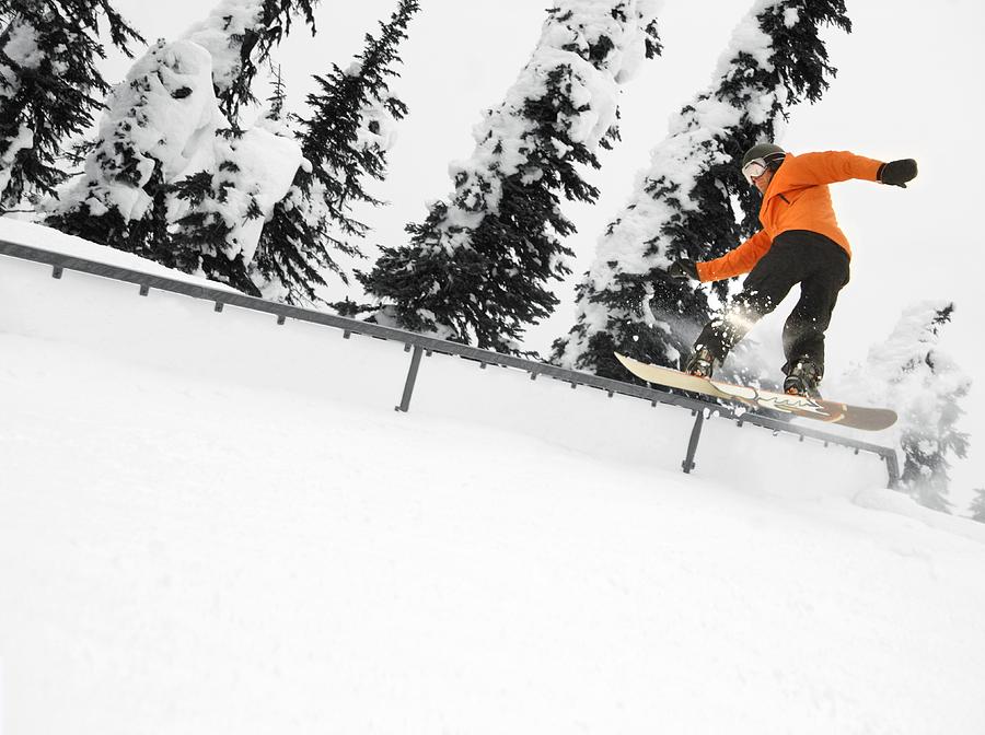 Person Snowboarding On A Railing Photograph