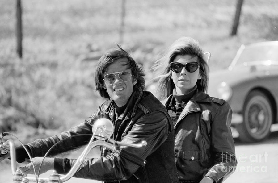 Peter Fonda and Nancy Sinatra on a Motorcycle Photograph by The Harrington Collection