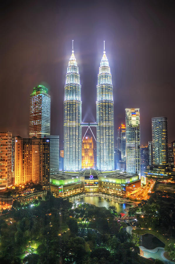 Petronas Twin Towers and KLCC Park at night Photograph by Daniel Chui