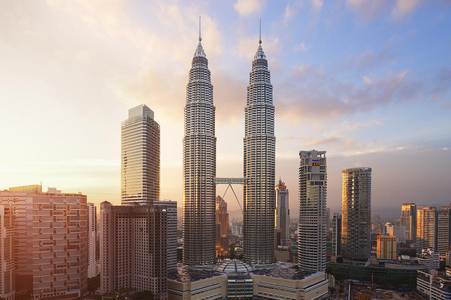 Petronas Twin Towers at sunset Photograph by Laurie Noble