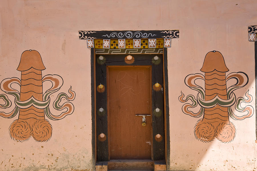Phallic fertility symbols painted outside house, Pana, Bhutan Photograph by Peter Adams