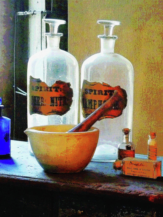 Pharmacist - Mortar and Pestle With Bottles Photograph by Susan Savad