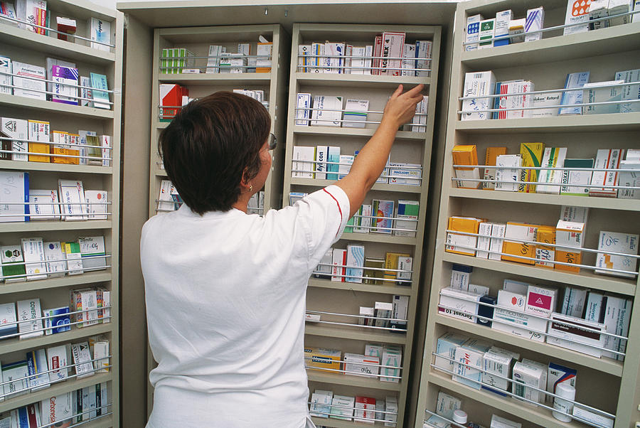 Pharmacy Medicine Cupboard Photograph by Mauro Fermariello/science Photo Library