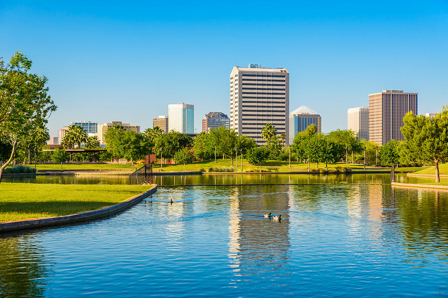 Phoenix Arizona skyline - park, pond, and skyscrapers cityscape background Photograph by Dszc