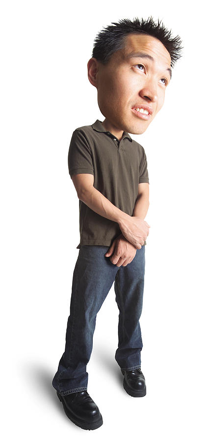 Photo Caricature Of A Young Asian Man In Jeans And A Green Polo Shirt As He Clasps His Hands Togeher And Looks Bored Photograph by Photodisc
