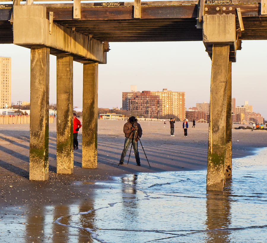 Photographer Under the Pier Photograph by Frank Winters