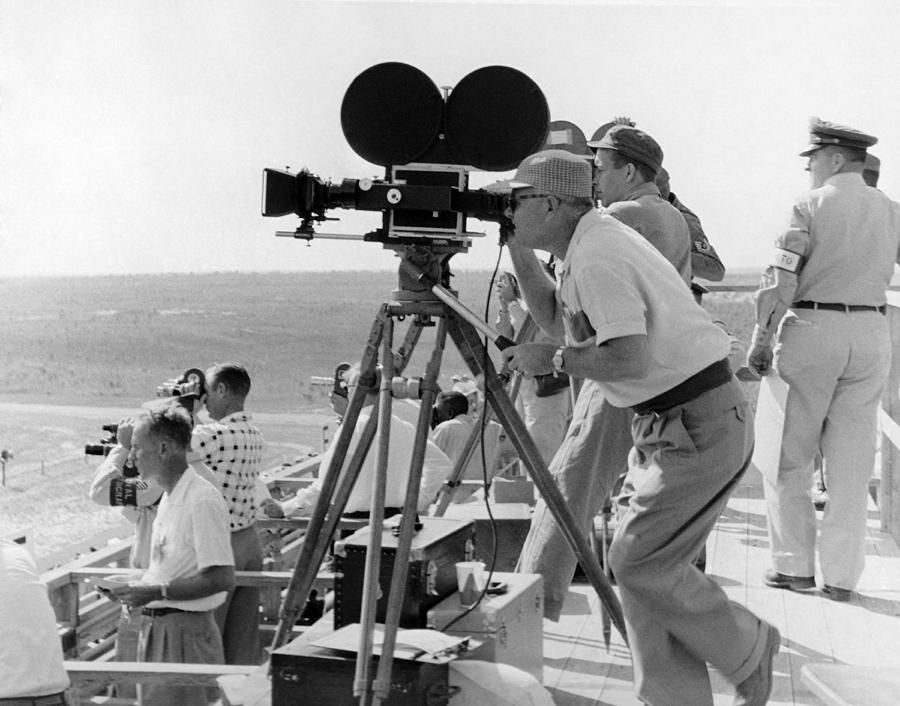 Black And White Photograph - Photographers Filming An Event by Underwood Archives