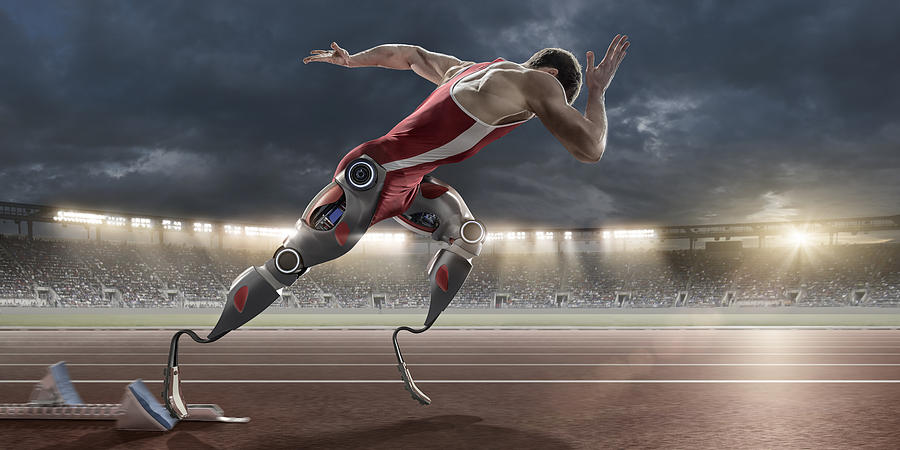 Physically Disabled Athlete Sprinting From Blocks With Artificial Robotic Legs Photograph by Peepo