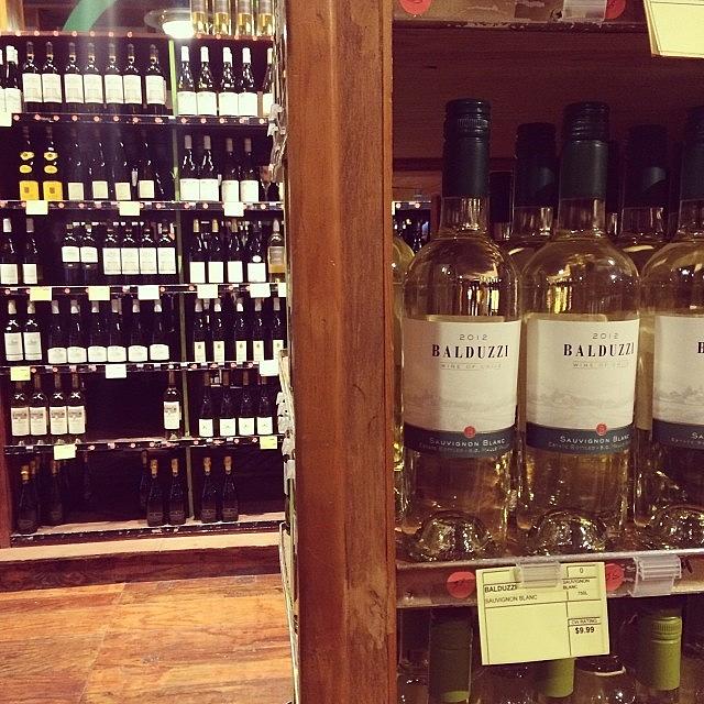 Picking Out That Perfect Bottle Of Wine Photograph by Allison Clayton
