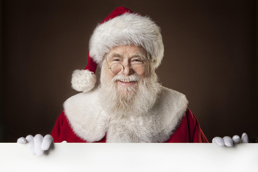 Pictures of Real Santa Claus holding a blank sign Photograph by Inhauscreative