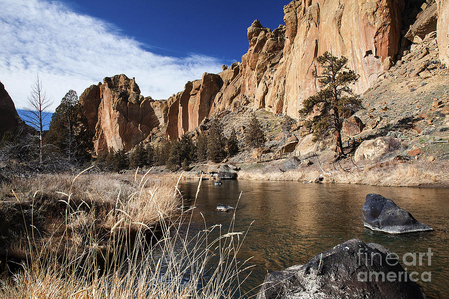 Picturesque Flowing Crooked River In The Smith Rock Mountains With Rugged Cliffs And Blue Sky Photograph by Jerry Cowart