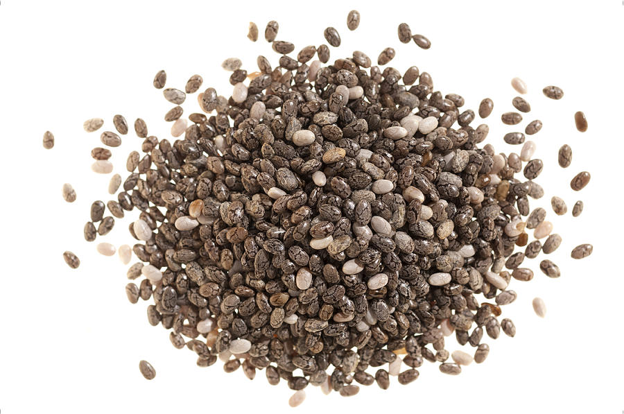 Pile of chia seeds on white Photograph by Stockcam