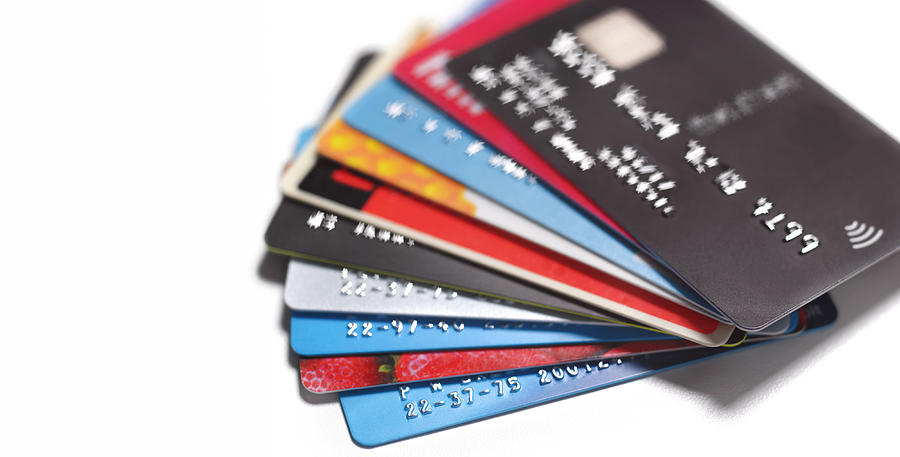 Pile Of Credit Cards Photograph by Peter Dazeley