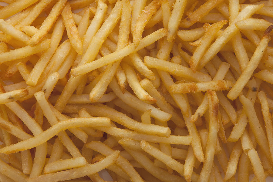 Pile of French fries Photograph by Mike Kemp